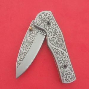 Handmade folding pocket knife with engraved handle, ideal for outdoor camping, everyday carry, or gifting.
